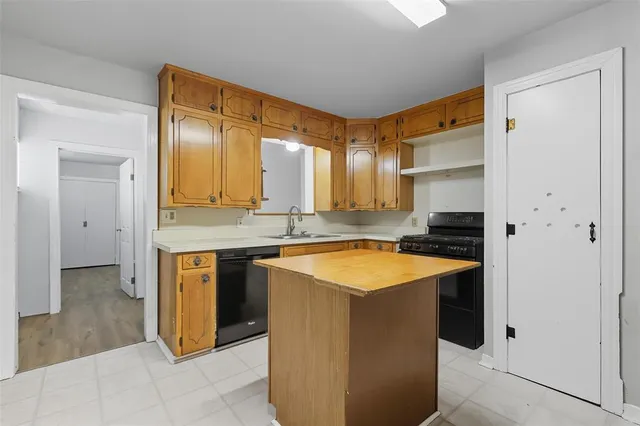 a spacious bathroom with a granite countertop sink and a mirror