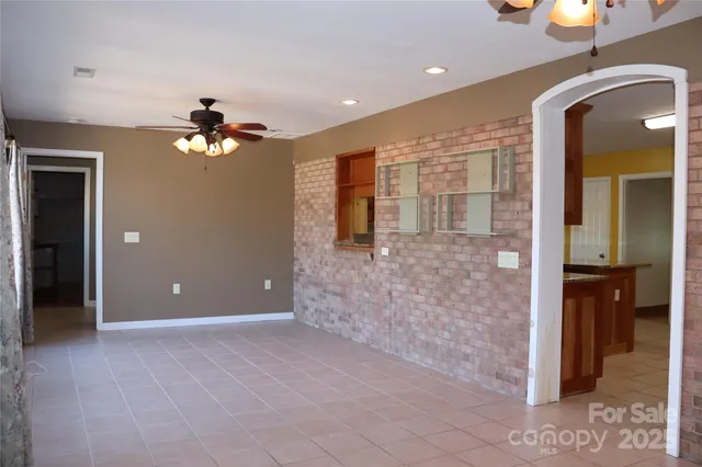 a view of a hallway with a chandelier