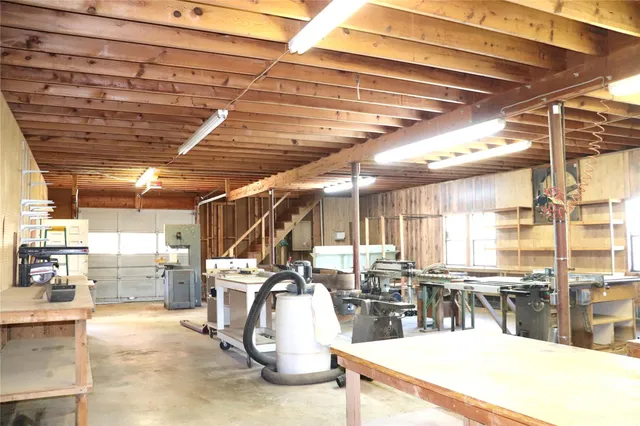 a view of a room with wooden walls