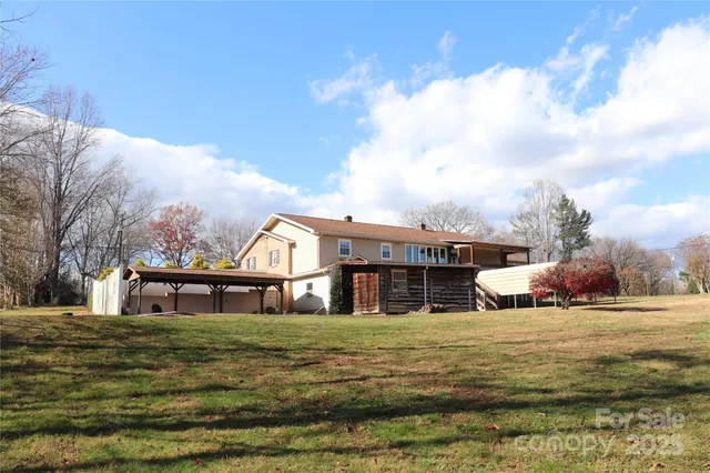 a view of a house with a big yard