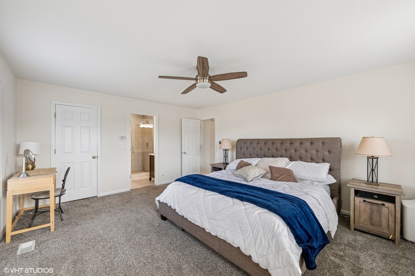 512 Braemar Lane Barrington, IL 60010 - Photo 11 of 24 a bedroom with a bed and a chandelier