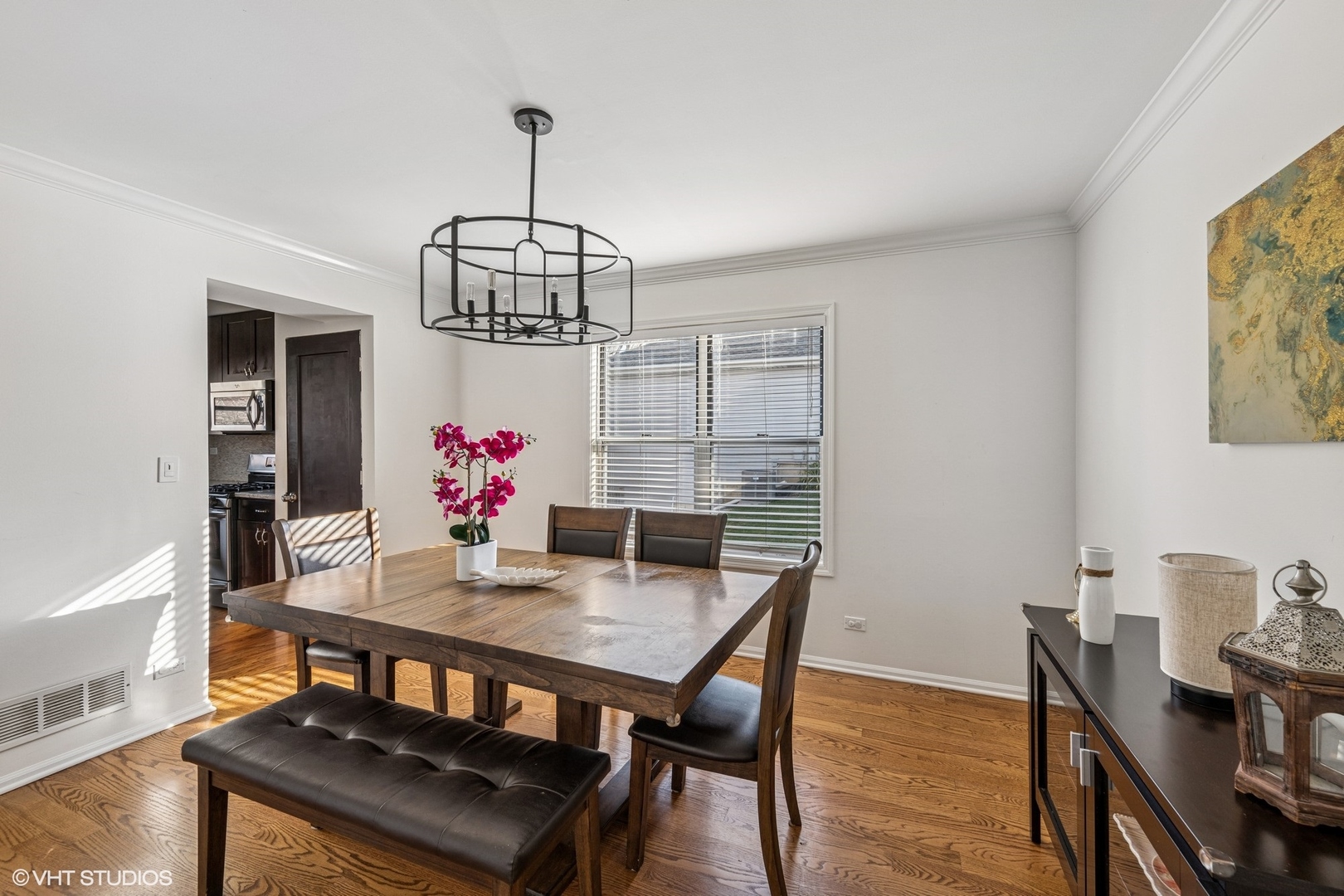 512 Braemar Lane Barrington, IL 60010 - Photo 8 of 24 a view of a dining room with furniture wooden floor and chandelier