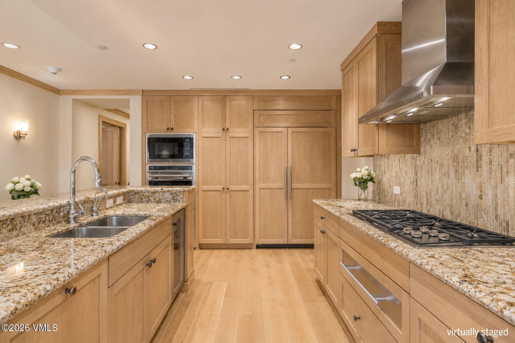 1 Vail Road, Unit 9204 Vail, CO 81657 - Photo 9 of 27 a kitchen with a sink stove and refrigerator