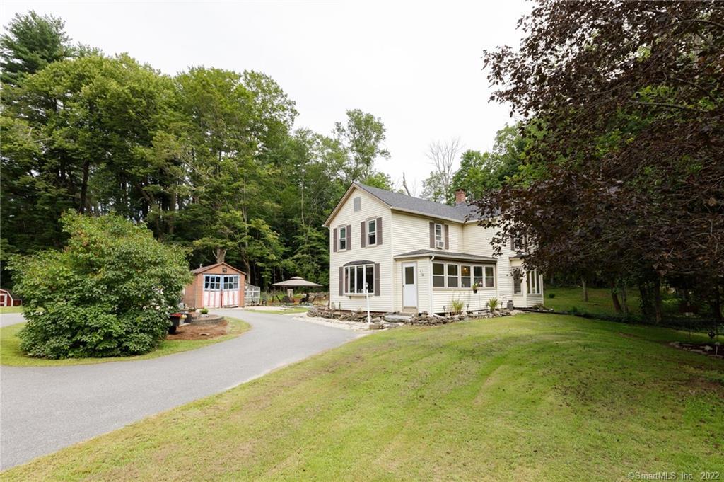 54 Pleasant Valley Road Barkhamsted, CT 06063 - Photo 1 of 1 a front view of a house with a yard and trees