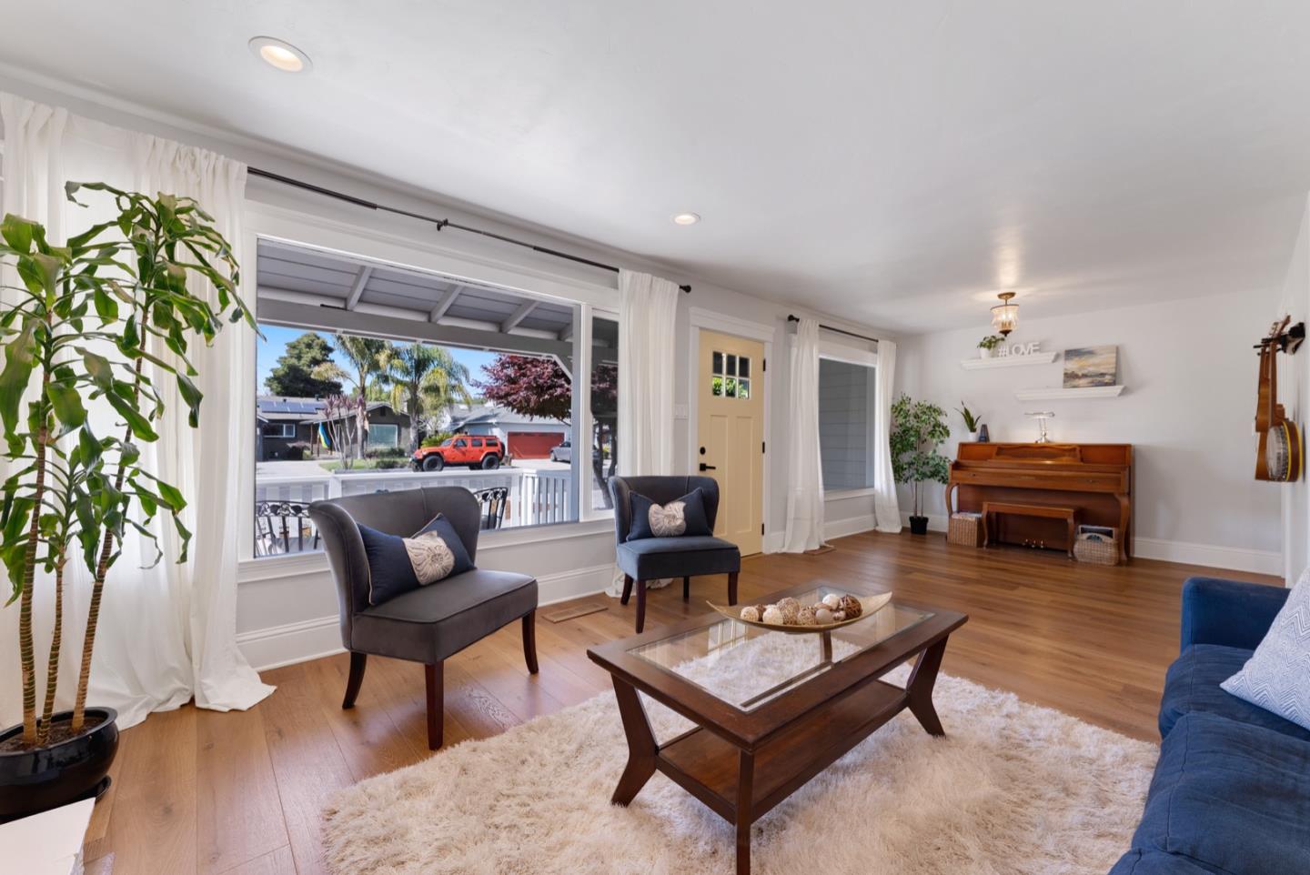 1240 Fewtrell Drive Campbell, CA 95008 - Photo 13 of 50 a living room with furniture a rug a potted plant and a large window