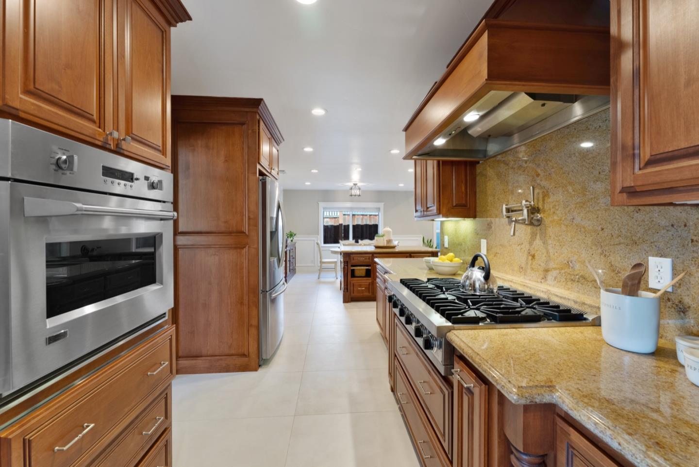 1240 Fewtrell Drive Campbell, CA 95008 - Photo 20 of 50 a kitchen with stainless steel appliances granite countertop a stove and a refrigerator