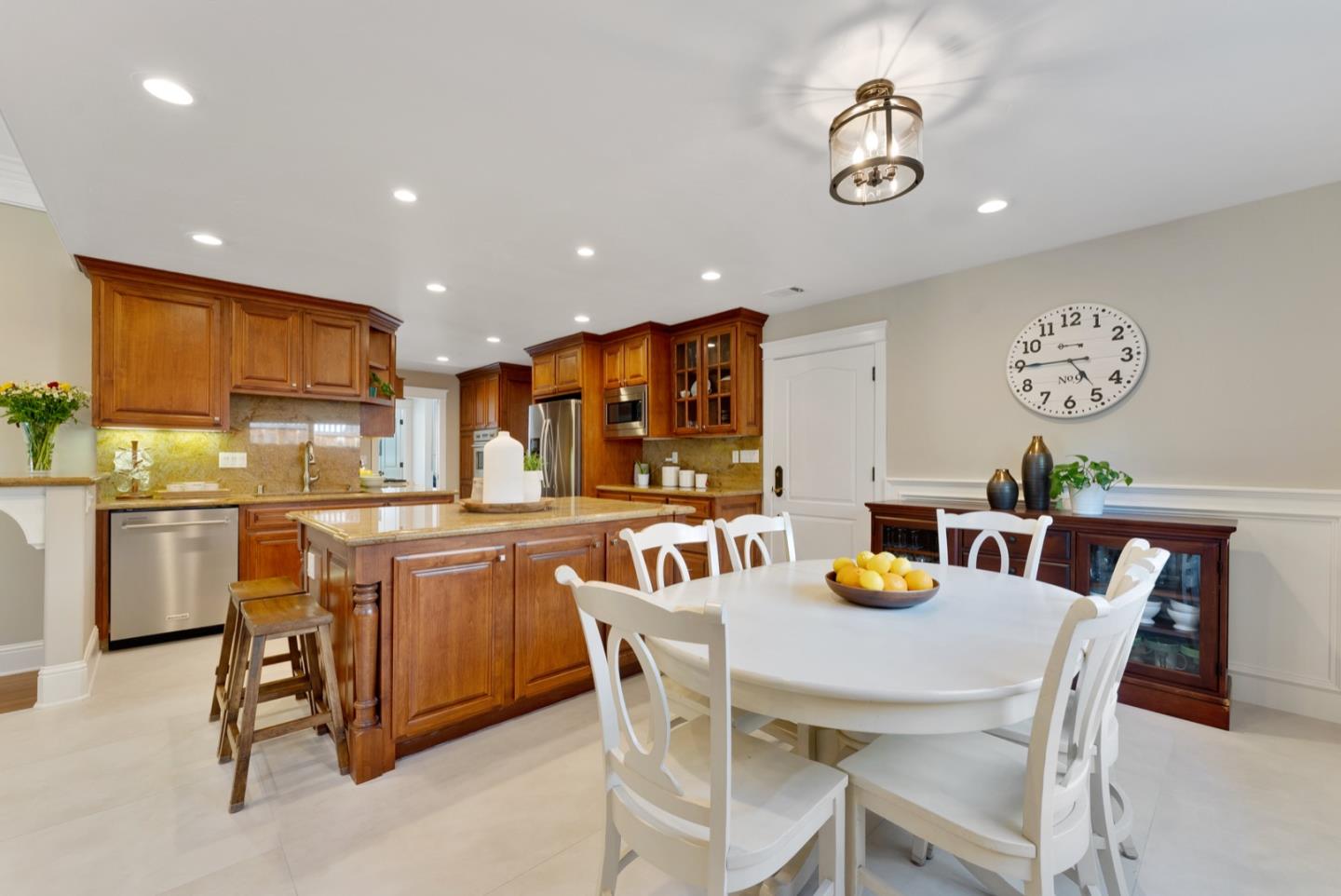 1240 Fewtrell Drive Campbell, CA 95008 - Photo 26 of 50 a kitchen with stainless steel appliances granite countertop a dining table and chairs