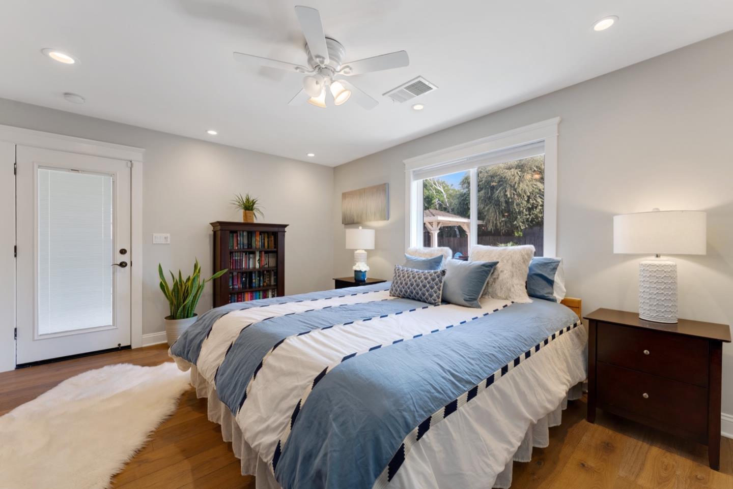 1240 Fewtrell Drive Campbell, CA 95008 - Photo 29 of 50 a bedroom with a large bed and a chandelier