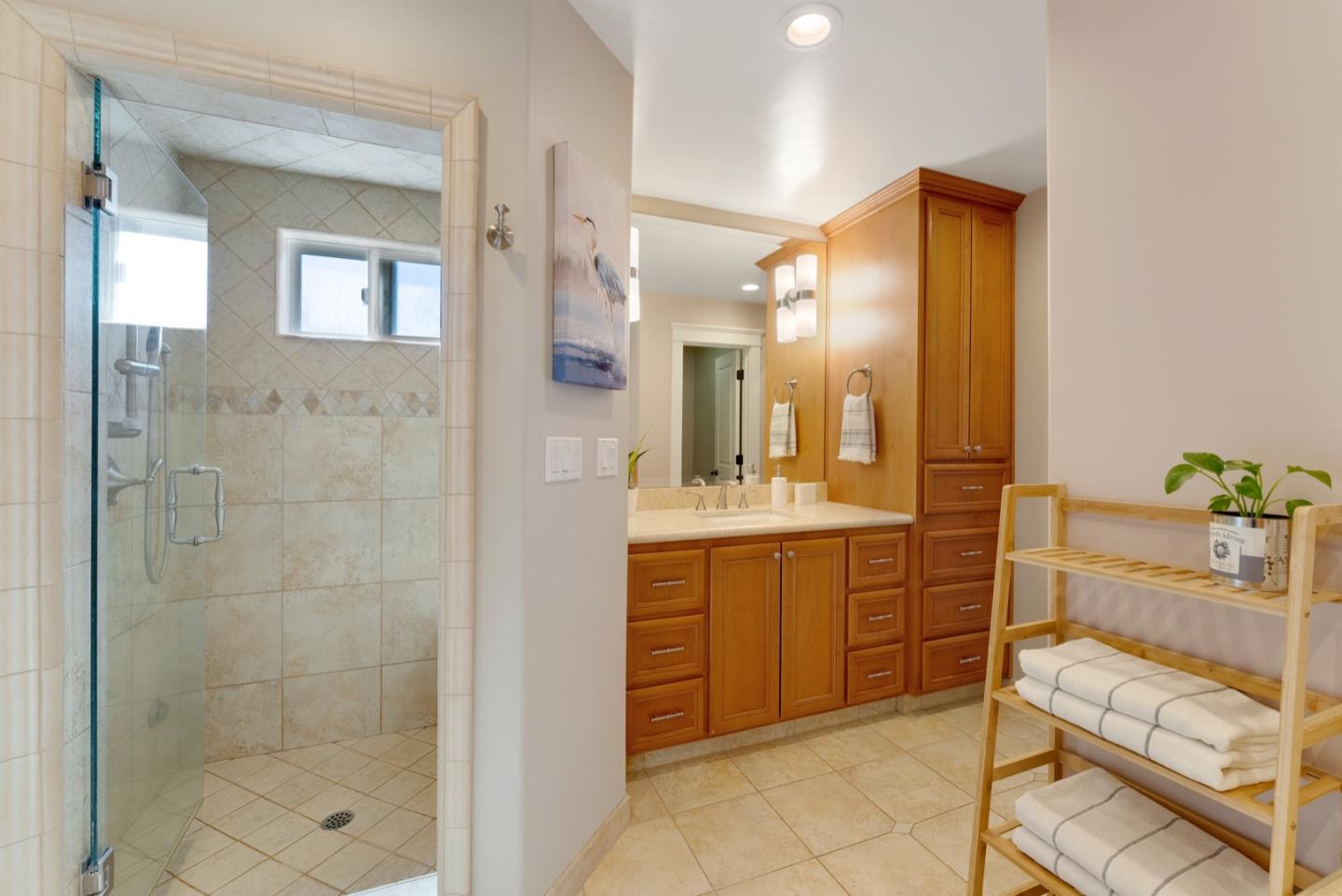 1240 Fewtrell Drive Campbell, CA 95008 - Photo 38 of 50 a bathroom with a granite countertop sink mirror and shower