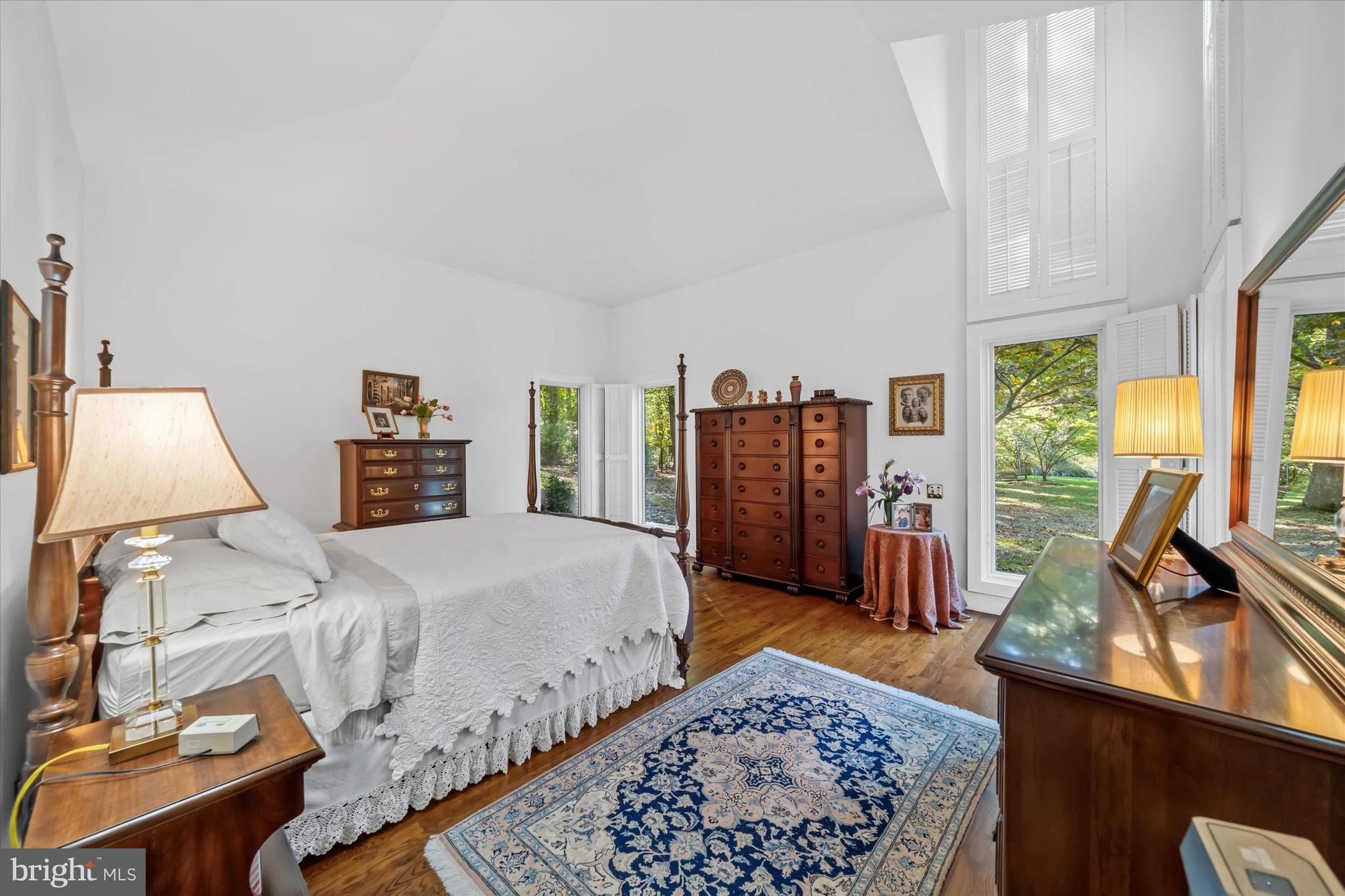 6 Carriage Road Greenville, DE 19807 - Photo 12 of 59 a bed room with a bed window and a chair