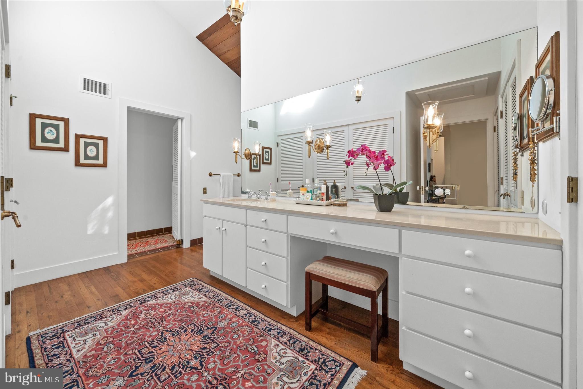 6 Carriage Road Greenville, DE 19807 - Photo 15 of 59 a spacious bathroom with a sink vanity and mirror