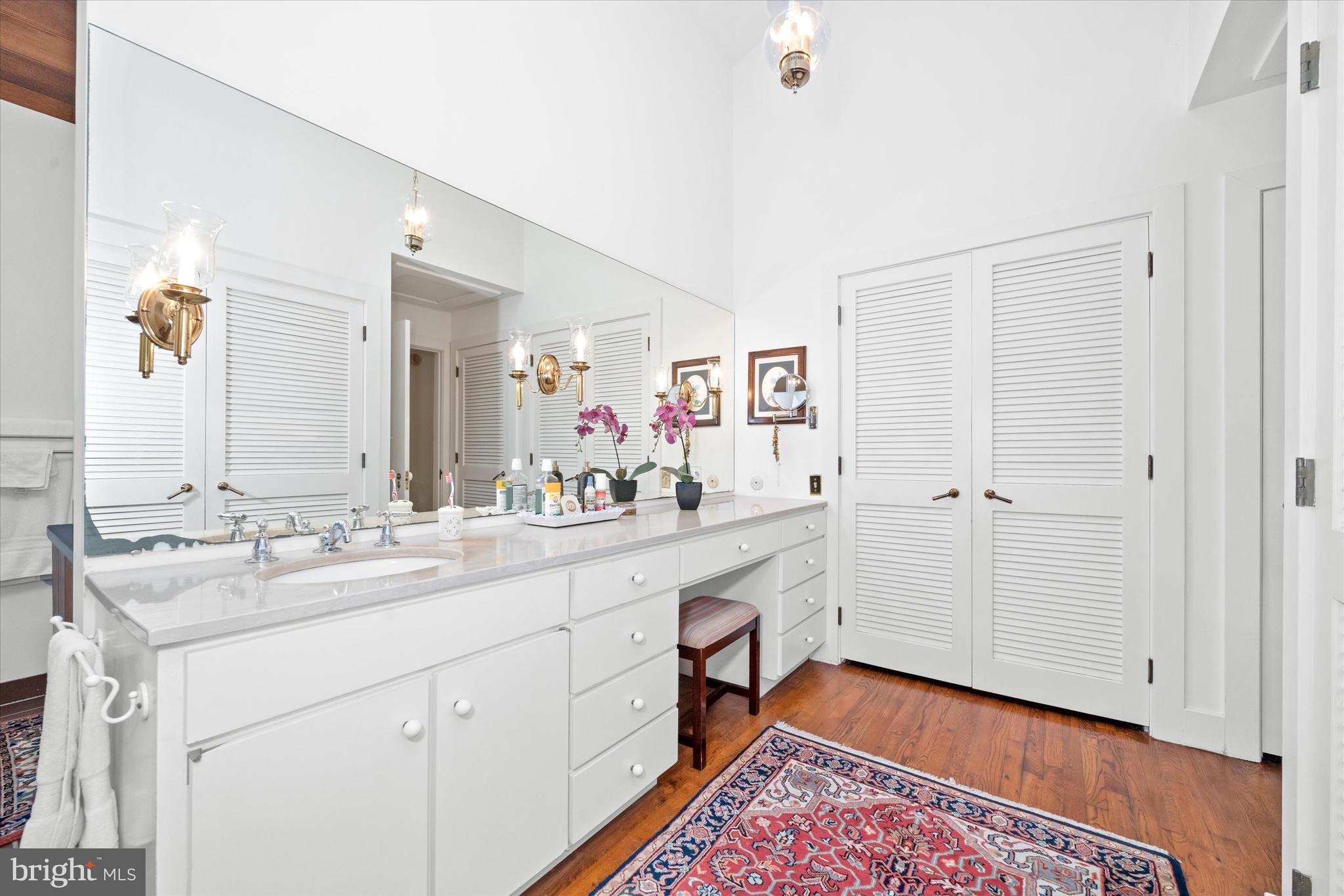 6 Carriage Road Greenville, DE 19807 - Photo 16 of 59 a spacious bathroom with a sink mirror and vanity
