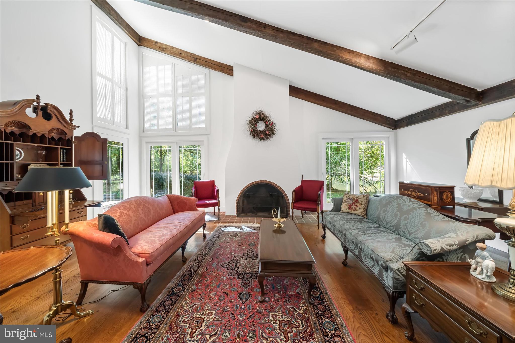 6 Carriage Road Greenville, DE 19807 - Photo 20 of 59 a living room with furniture and a fireplace