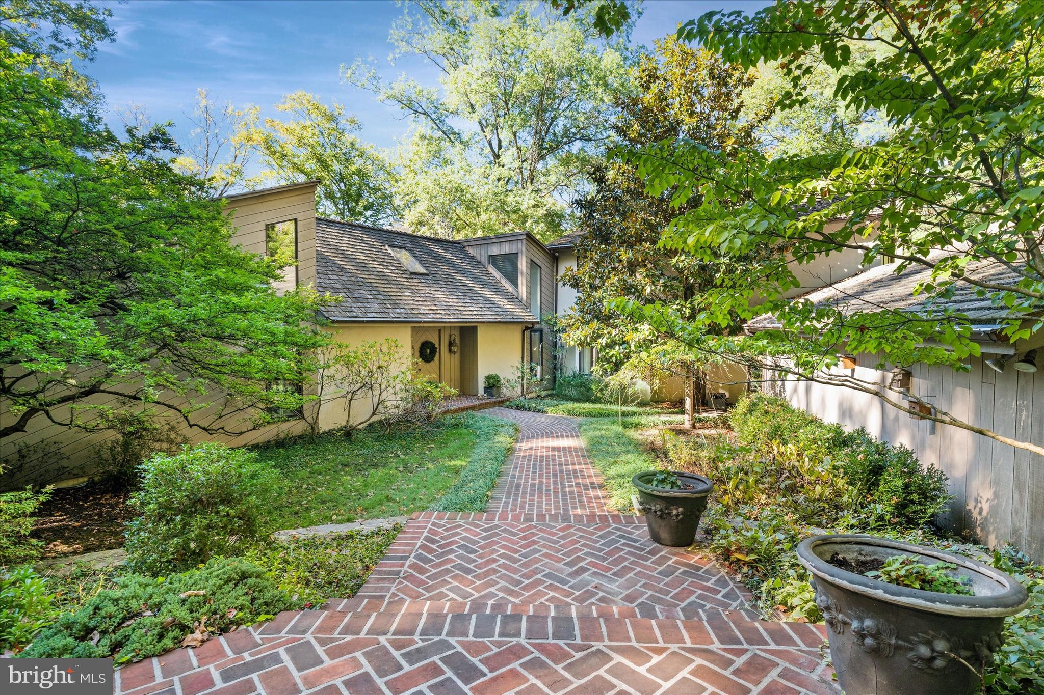6 Carriage Road Greenville, DE 19807 - Photo 2 of 59 a view of a chair and table in backyard of the house