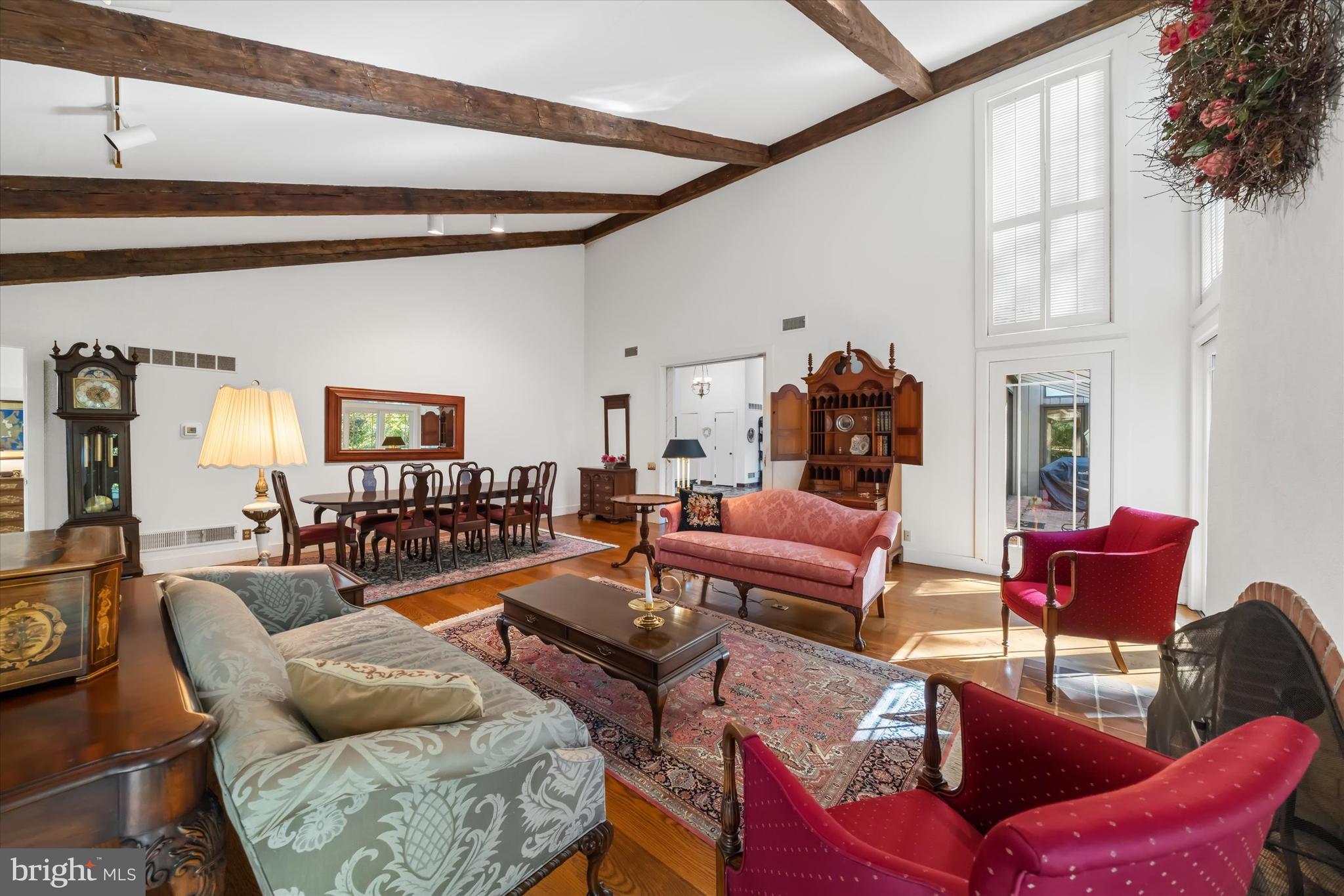 6 Carriage Road Greenville, DE 19807 - Photo 22 of 59 a living room with furniture a rug and a chandelier