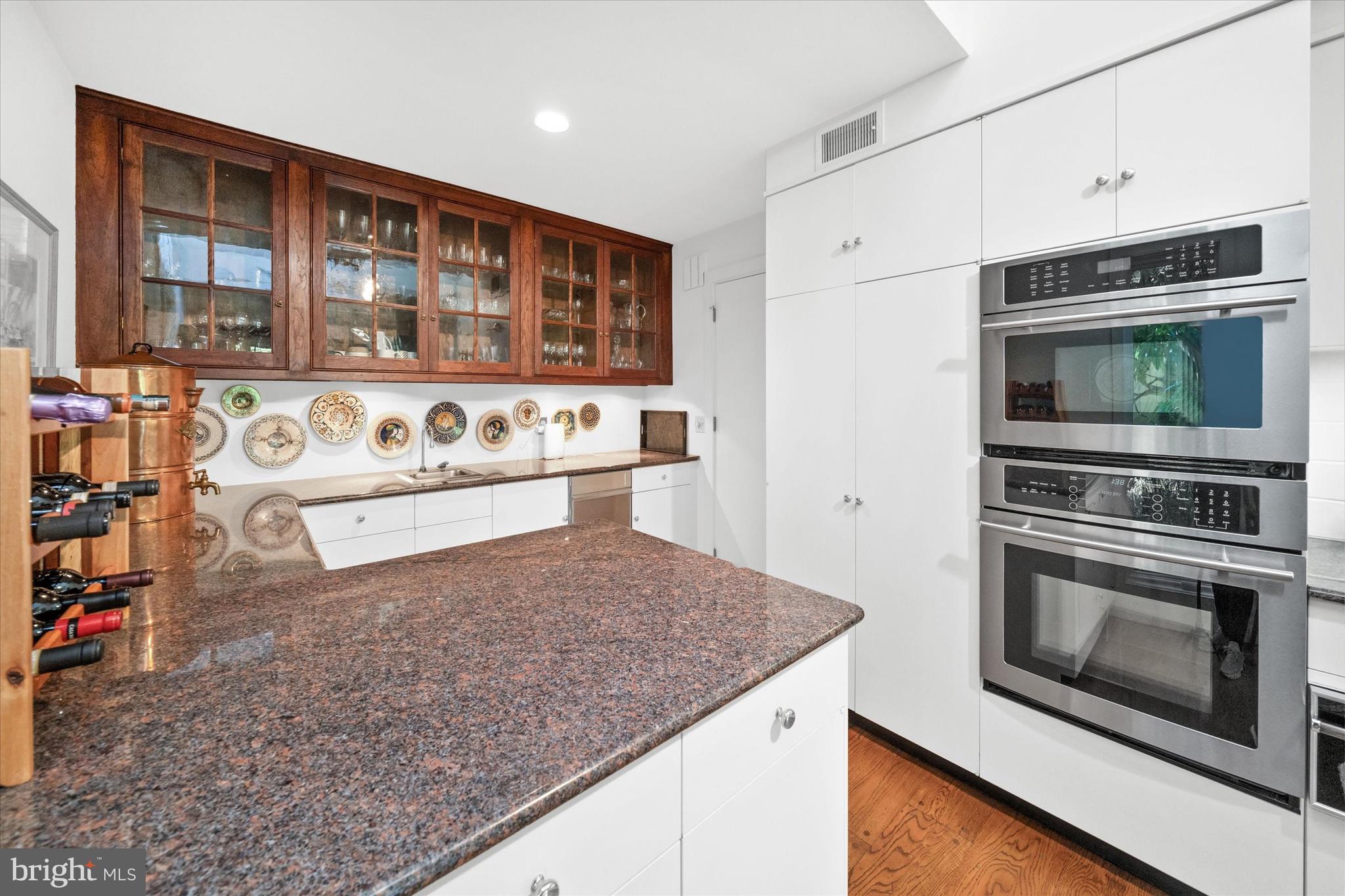 6 Carriage Road Greenville, DE 19807 - Photo 24 of 59 a kitchen with stainless steel appliances granite countertop a stove and a sink
