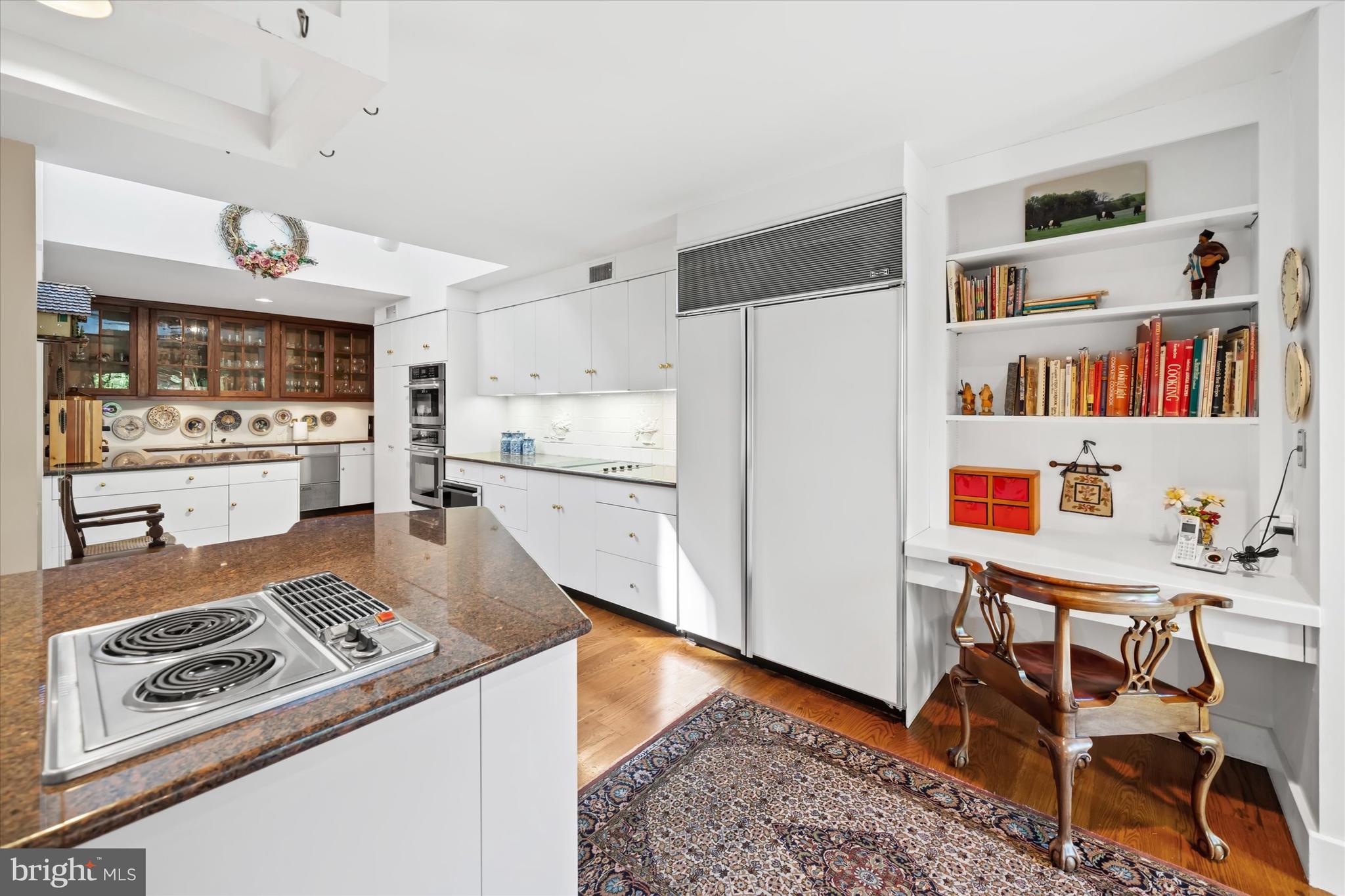 6 Carriage Road Greenville, DE 19807 - Photo 27 of 59 a kitchen with stainless steel appliances granite countertop a refrigerator and a stove top oven