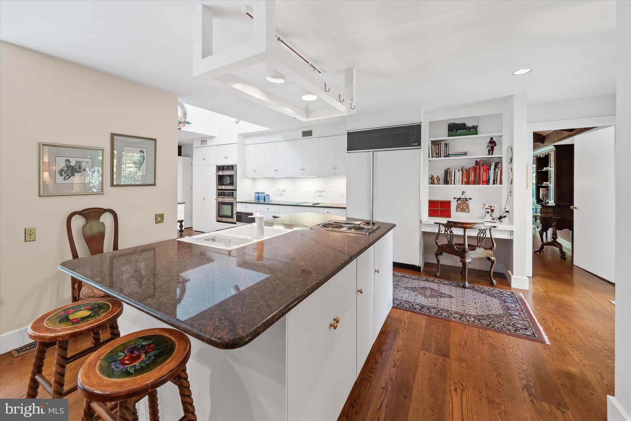 6 Carriage Road Greenville, DE 19807 - Photo 28 of 59 a living room with furniture and a wooden floor