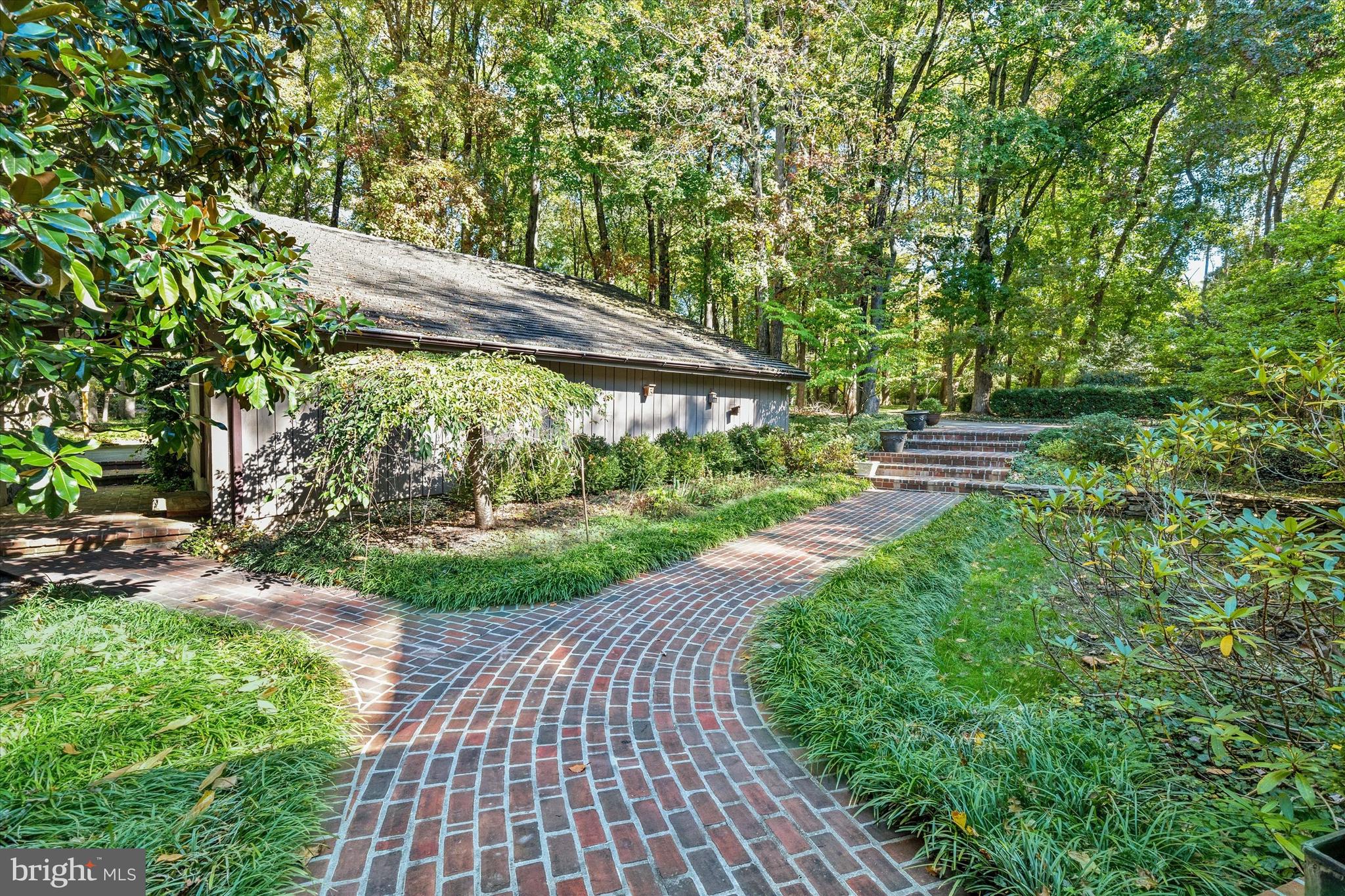 6 Carriage Road Greenville, DE 19807 - Photo 3 of 59 a view of a backyard with pathway