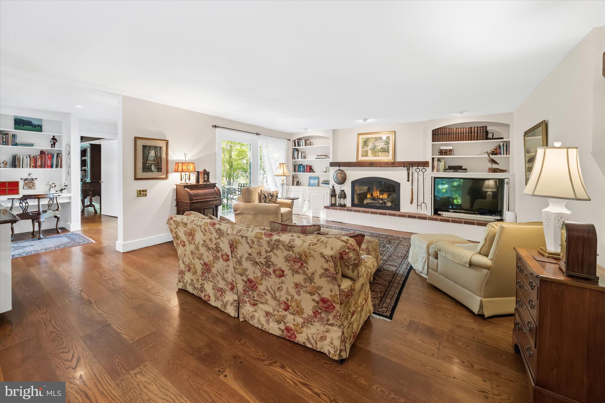6 Carriage Road Greenville, DE 19807 - Photo 33 of 59 a living room with furniture and a fireplace