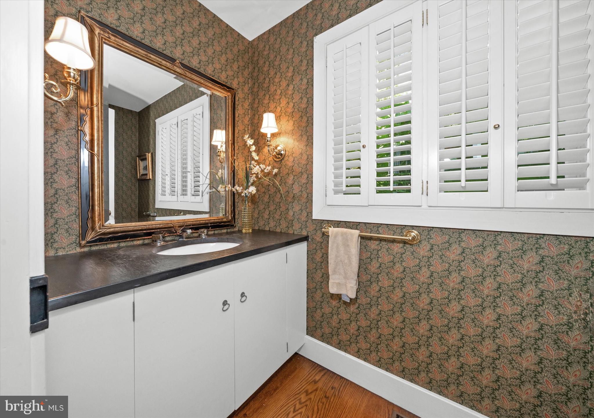 6 Carriage Road Greenville, DE 19807 - Photo 34 of 59 a bathroom with a granite countertop sink and a large mirror