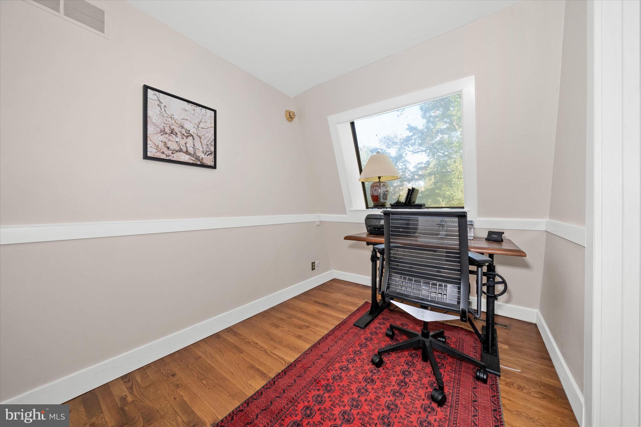 6 Carriage Road Greenville, DE 19807 - Photo 37 of 59 a room with wooden floor and a window