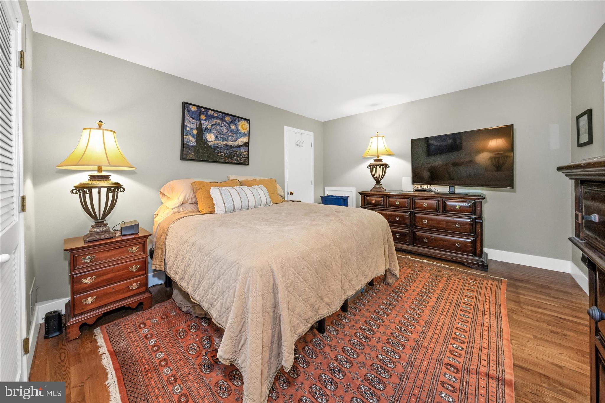 6 Carriage Road Greenville, DE 19807 - Photo 38 of 59 a bedroom with bed and a flat screen tv