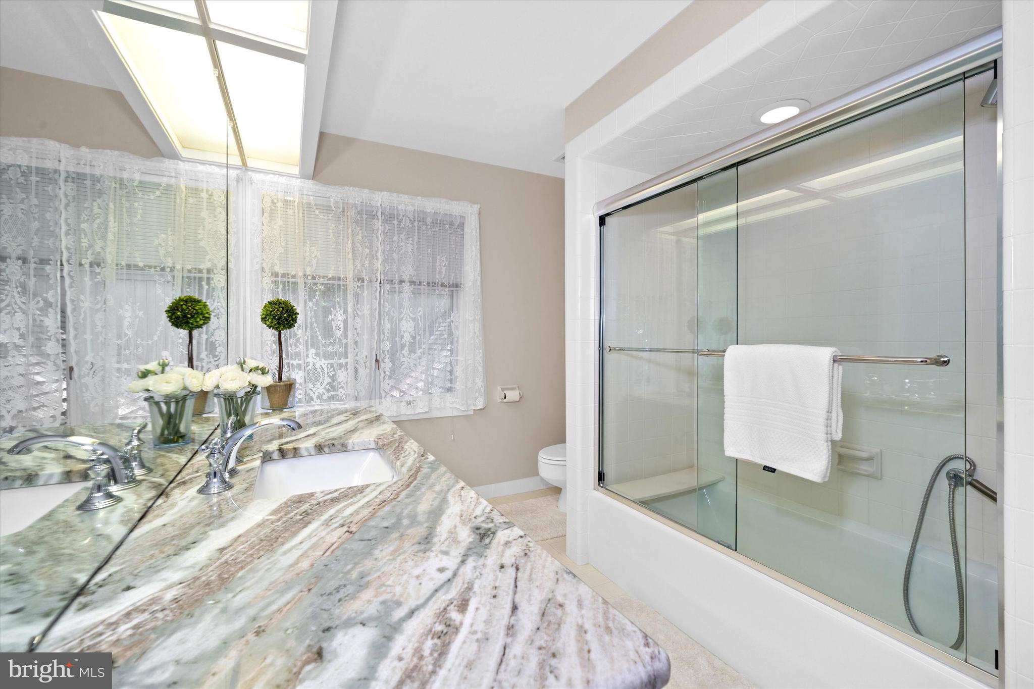 6 Carriage Road Greenville, DE 19807 - Photo 44 of 59 a bathroom with a bathtub and a sink