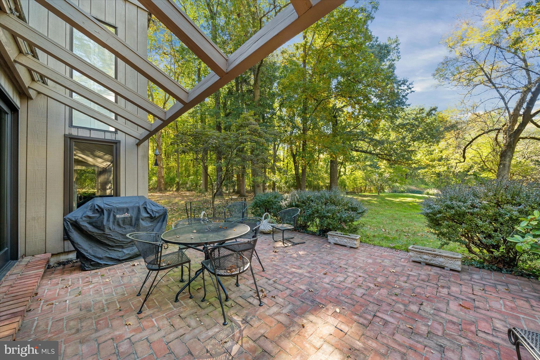 6 Carriage Road Greenville, DE 19807 - Photo 52 of 59 a view of a chairs and table in the patio
