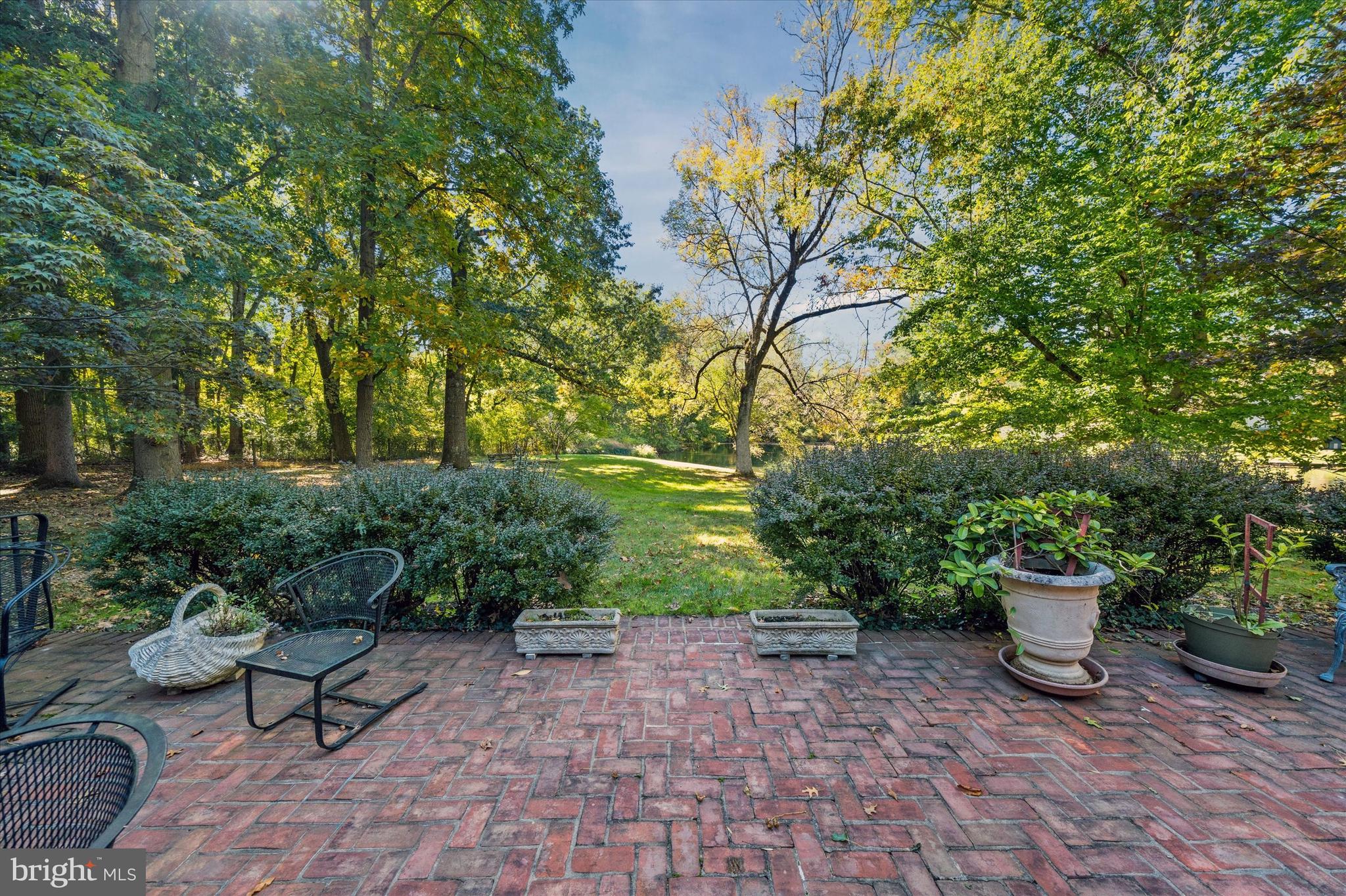 6 Carriage Road Greenville, DE 19807 - Photo 54 of 59 a view of a backyard with garden and plants