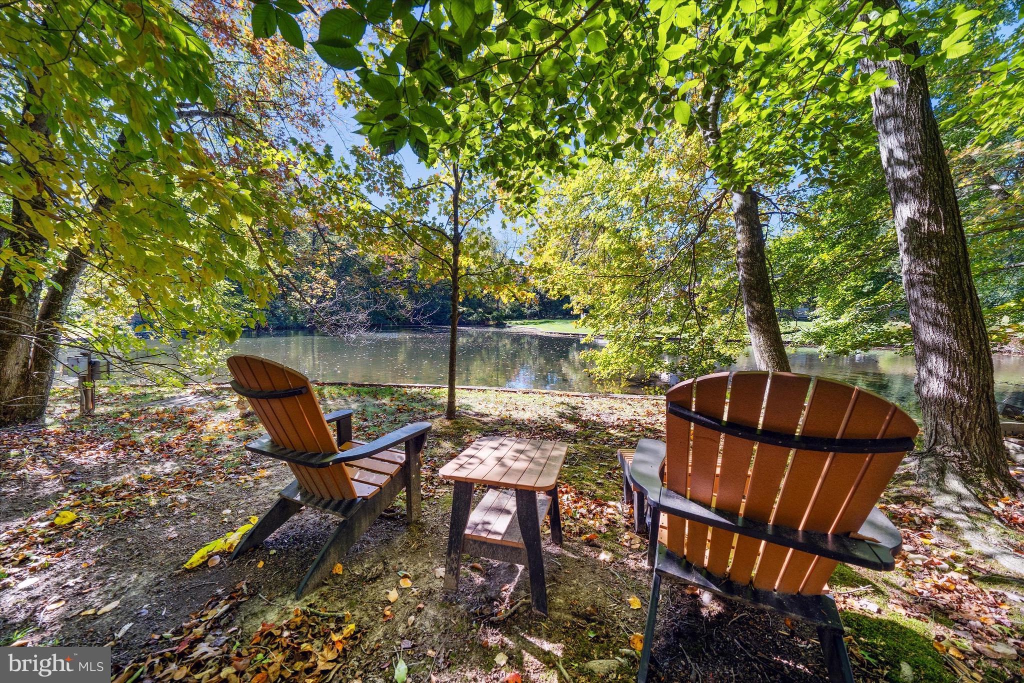 6 Carriage Road Greenville, DE 19807 - Photo 57 of 59 a view of a chair and table in the backyard