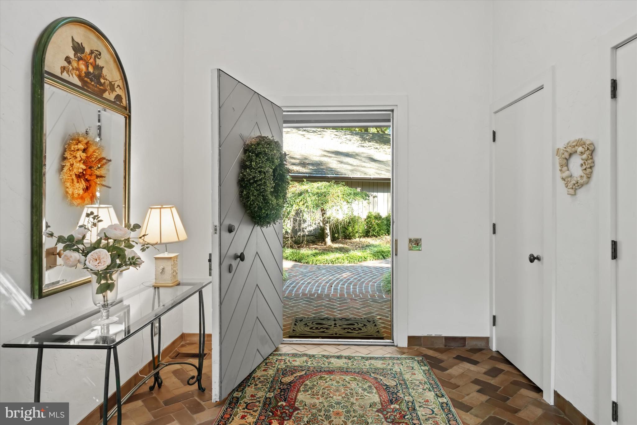 6 Carriage Road Greenville, DE 19807 - Photo 6 of 59 a view of an entryway with wooden floor