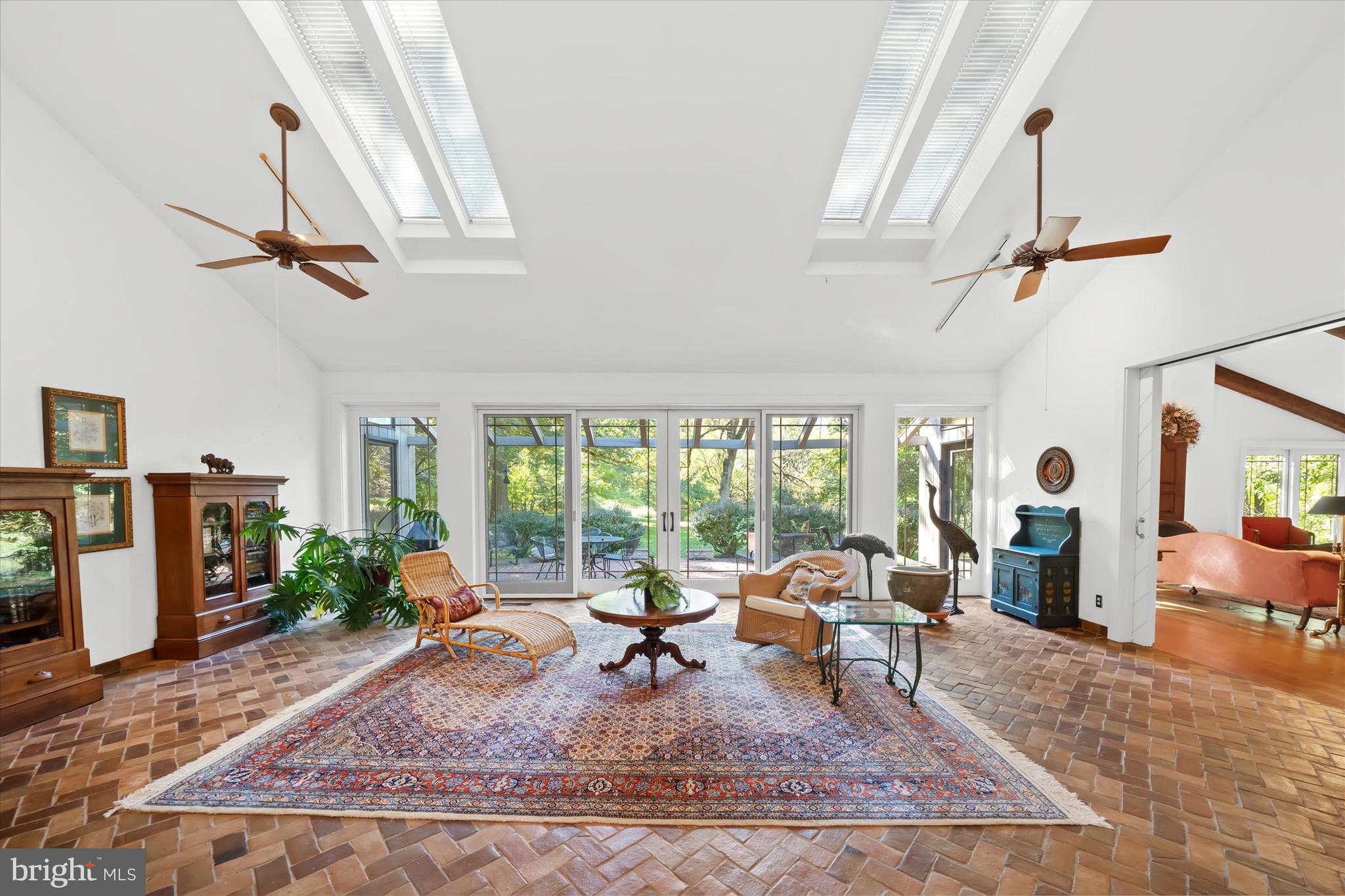 6 Carriage Road Greenville, DE 19807 - Photo 8 of 59 a living room with furniture a rug a fireplace and a large window