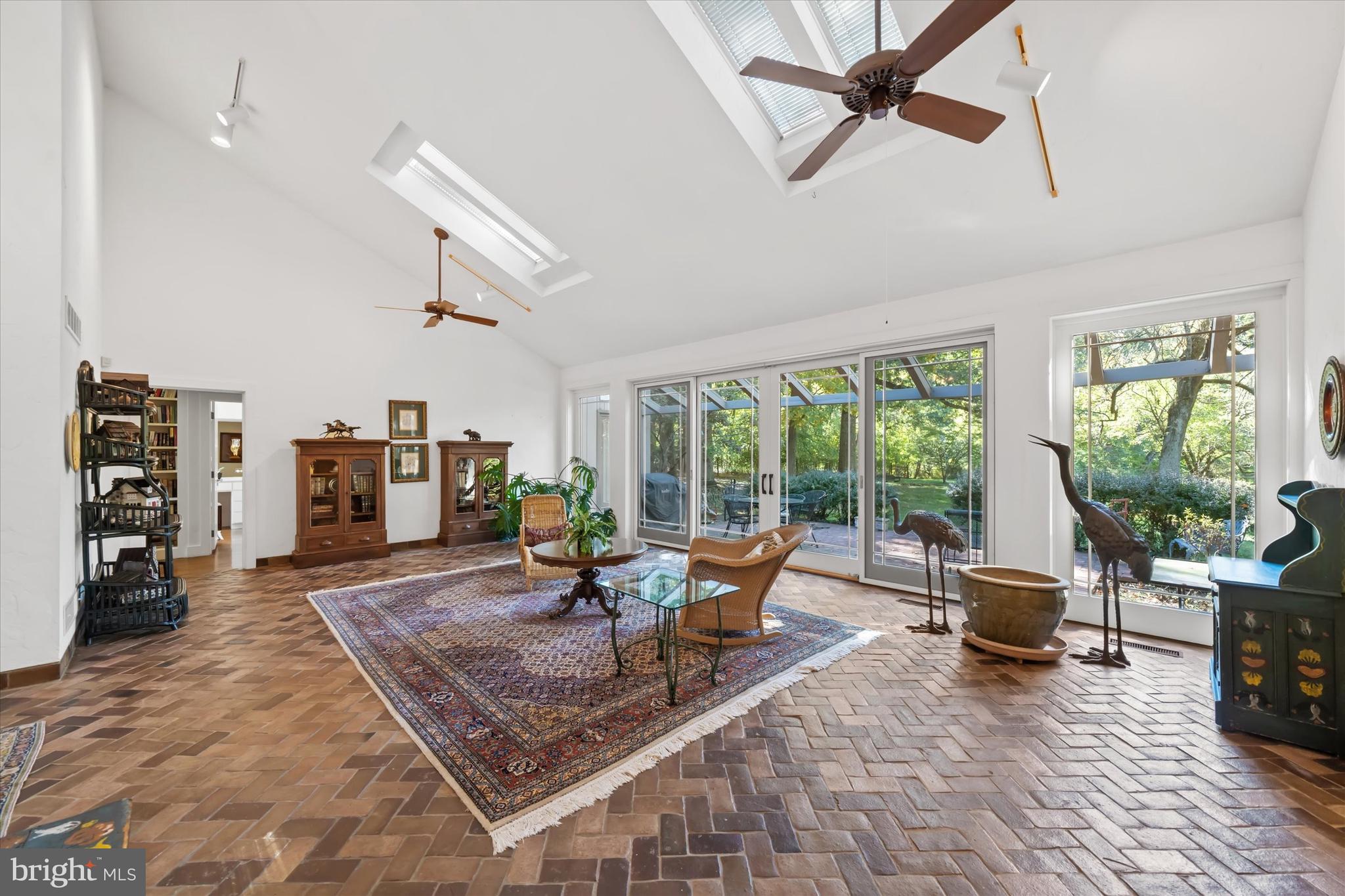 6 Carriage Road Greenville, DE 19807 - Photo 10 of 59 a living room with furniture and a floor to ceiling window