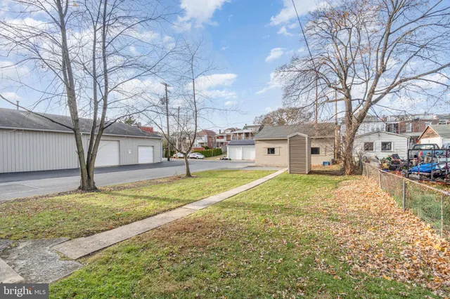 a view of a house with a yard and garage