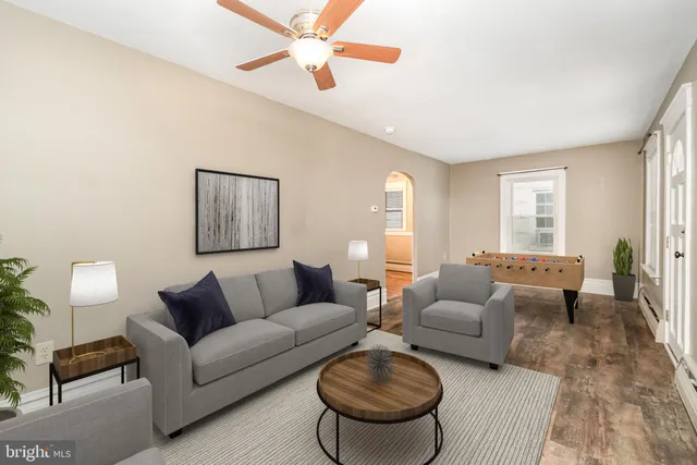 a living room with furniture and a large window