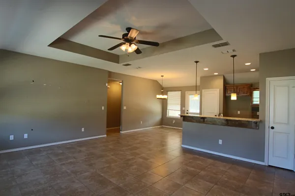 a view of a livingroom with a kitchen