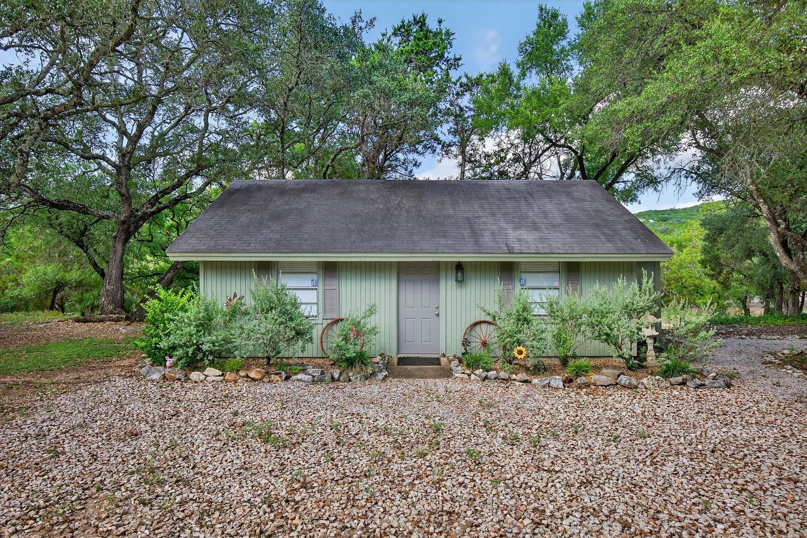 23644 Nameless Road Leander, TX 78641 - Photo 15 of 29 a view of a house with a garden and plants