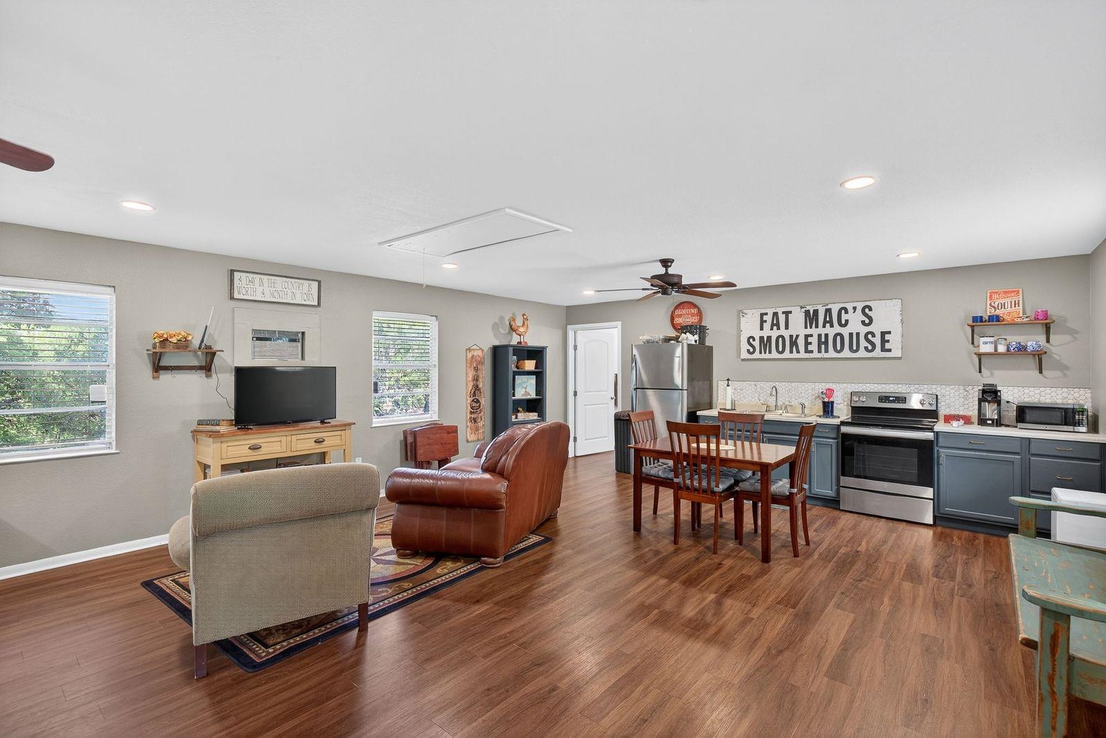 23644 Nameless Road Leander, TX 78641 - Photo 16 of 29 a living room with furniture and a flat screen tv