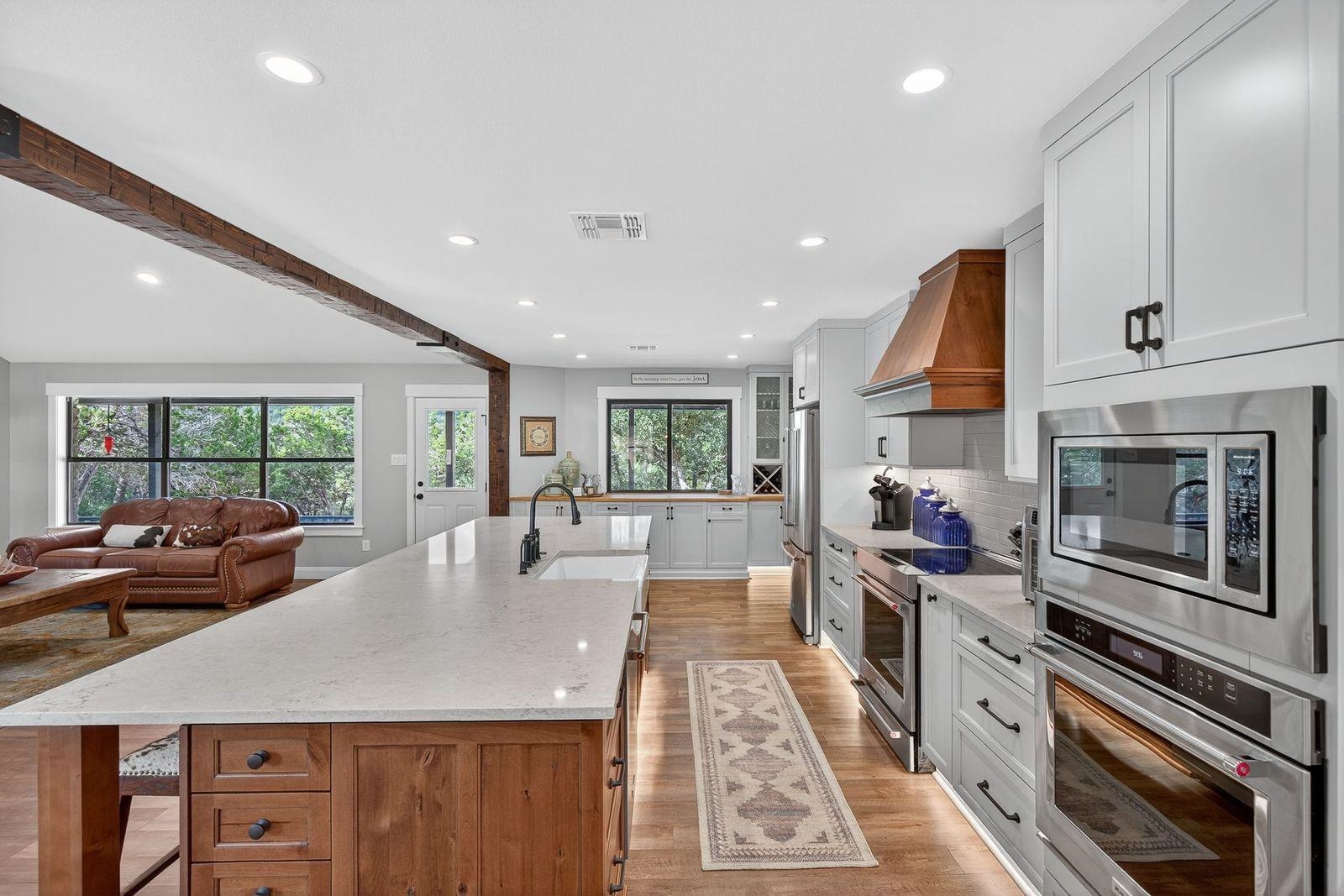 23644 Nameless Road Leander, TX 78641 - Photo 6 of 29 a kitchen with sink stove and cabinets