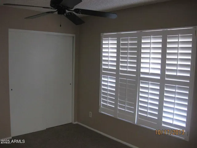a view of empty room with windows