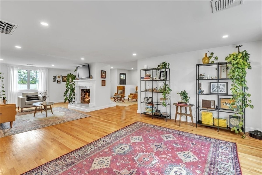 1057 Whitman Street Hanson, MA 02341 - Photo 16 of 40 a living room with furniture and a wooden floor