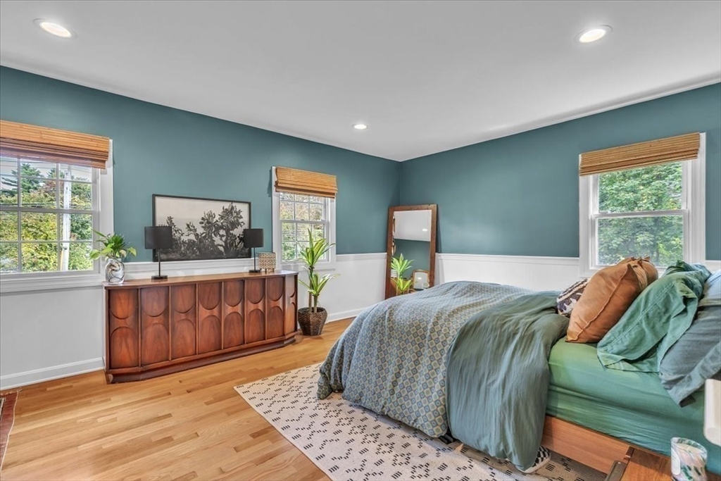 1057 Whitman Street Hanson, MA 02341 - Photo 19 of 40 a bedroom with a large bed and a window