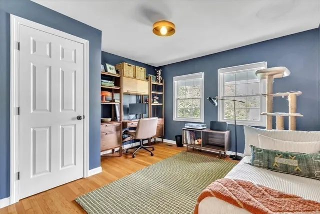 a bedroom with furniture and a window