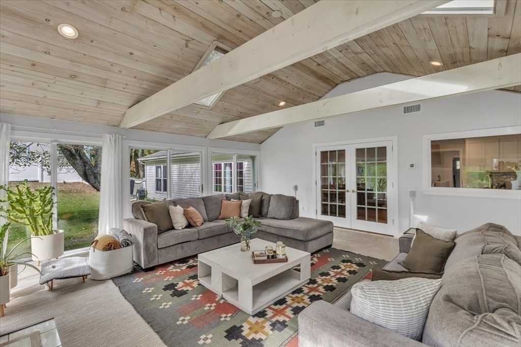 1057 Whitman Street Hanson, MA 02341 - Photo 27 of 40 a living room with furniture and a large window