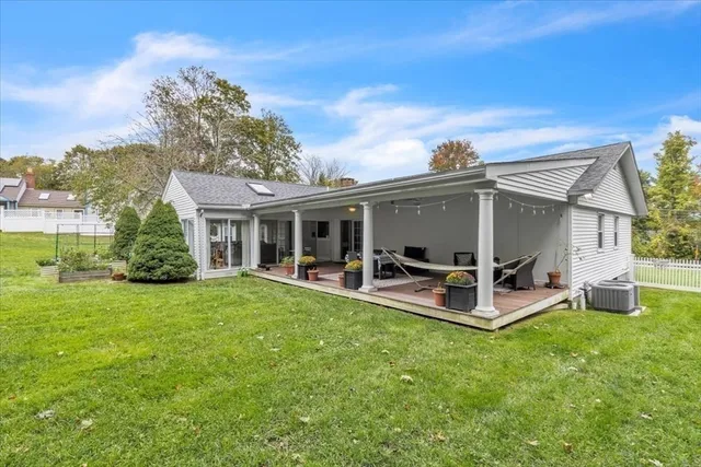a view of a house with backyard porch and garden