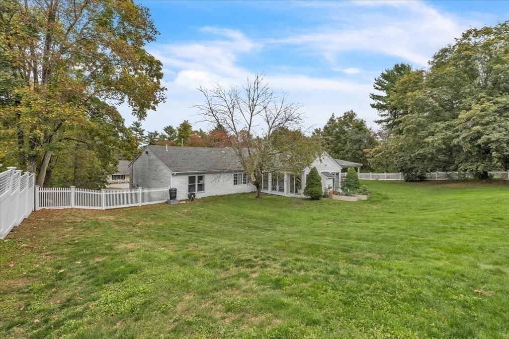 1057 Whitman Street Hanson, MA 02341 - Photo 32 of 40 a house with a garden