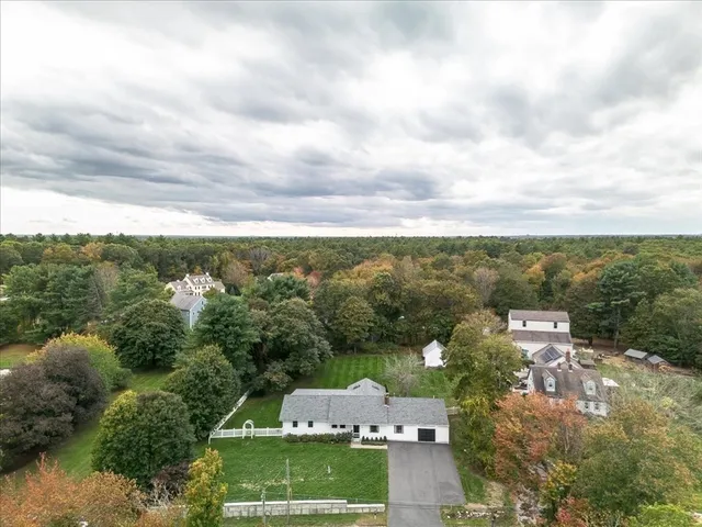 an aerial view of a house with mountain view