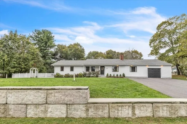 front view of a house with a yard
