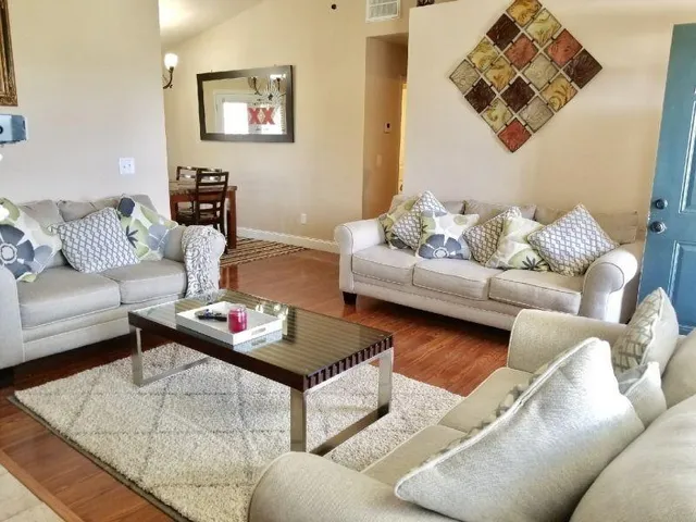 a living room with furniture and a couch